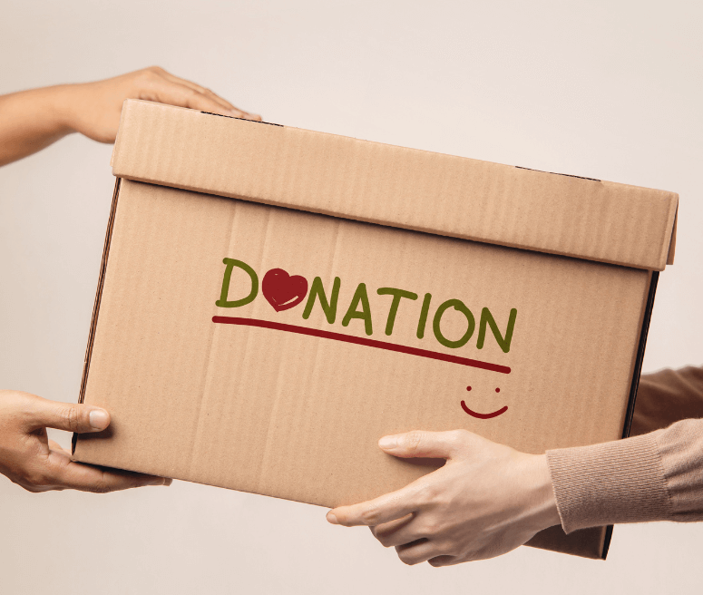 staff holding box with donation logo